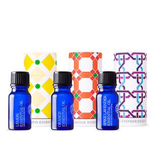 andaluz skincare lemon orange and lavender essential oils. three blue glass bottles in decorative boxes with spanish design inspired from the alhambra palace in granada spain