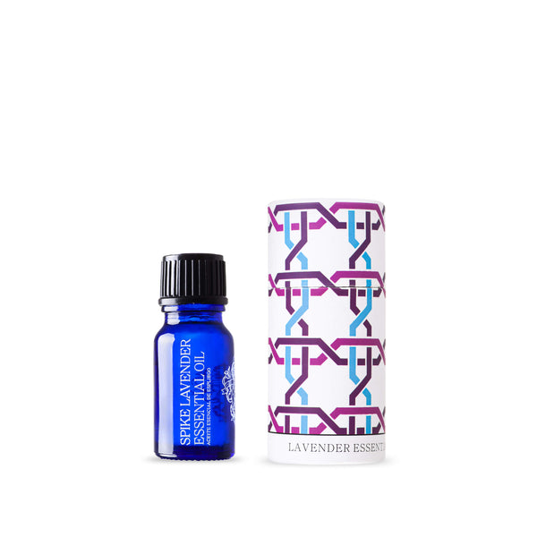andaluz skincare lavender essential oil in a bright blue glass bottle with a black cap. It comes in a colorful round box with a lid and design inspired from the alhambra palace in granada spain.