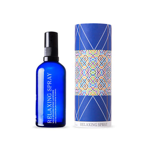 ANDALUZ Skincare Relaxing Spray made with organic Spanish spike lavender essential oil. It comes in a bright blue glass bottle with a black cap. The box it comes in is cylindrical, blue with a colorful spanish design inspired from the tiles at the alhambra palace in granada spain